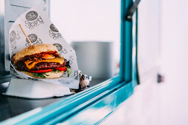 hamburger in window of food truck to go